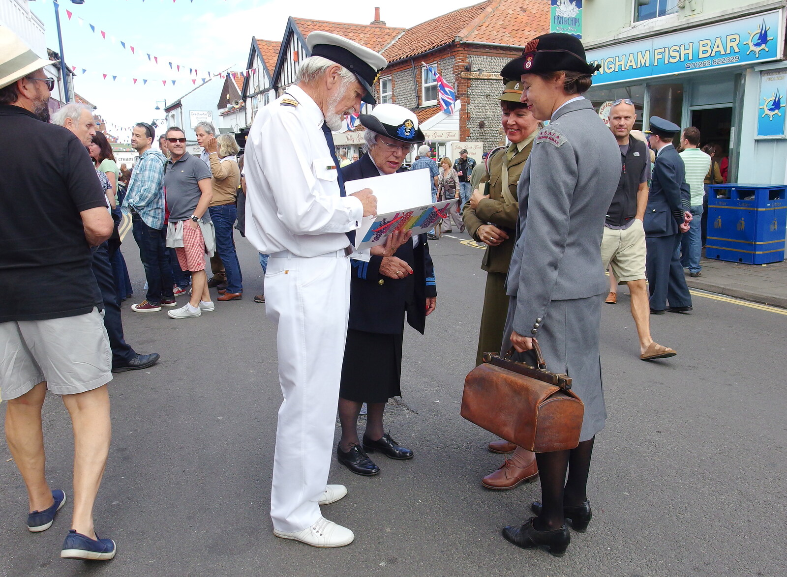 The admiral checks a card from Paul Bear's Adventures at a 1940s Steam Weekend, Holt, Norfolk - 22nd September 2013