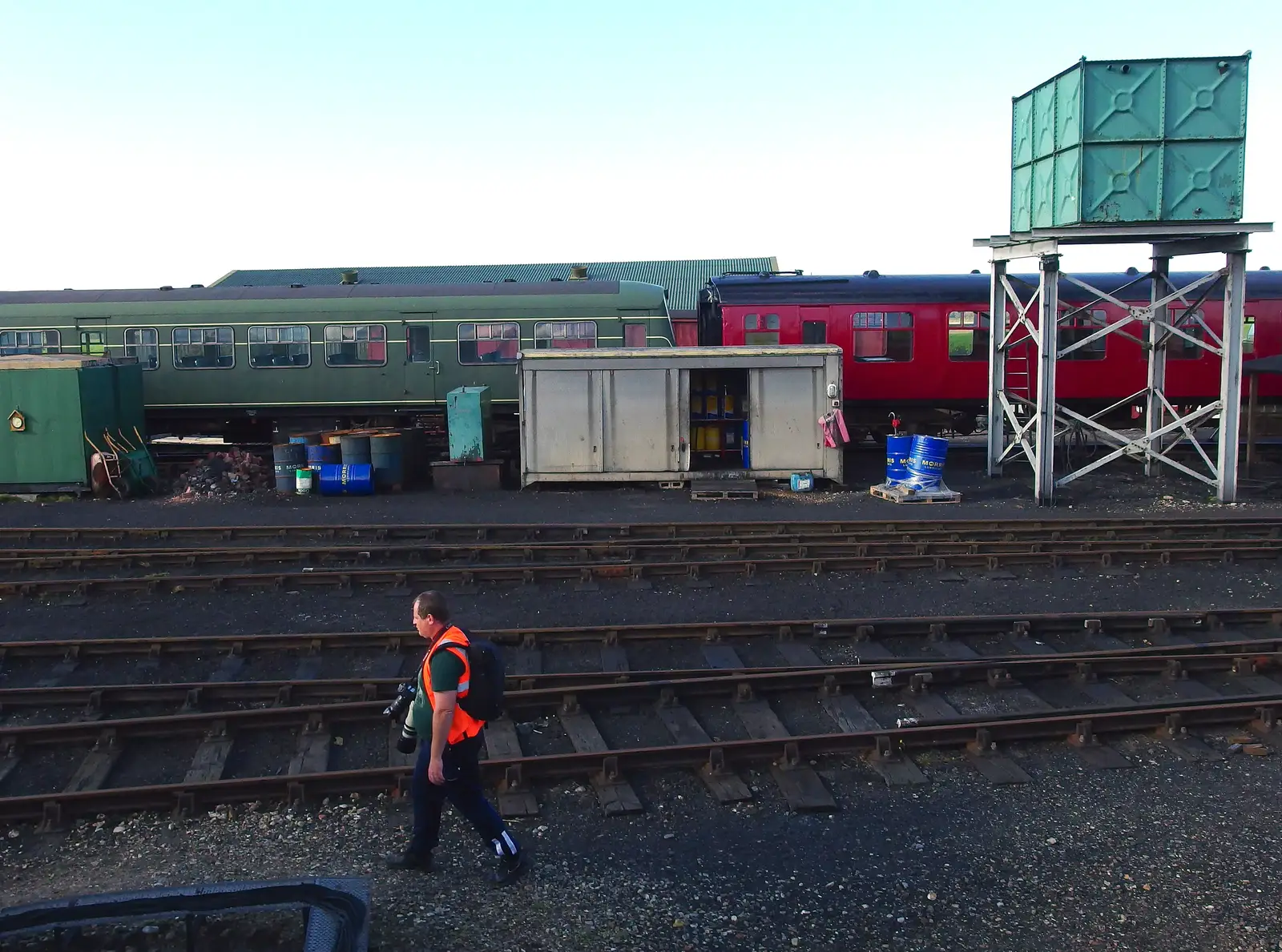 A photographer roams around the goods yard, from Paul Bear's Adventures at a 1940s Steam Weekend, Holt, Norfolk - 22nd September 2013