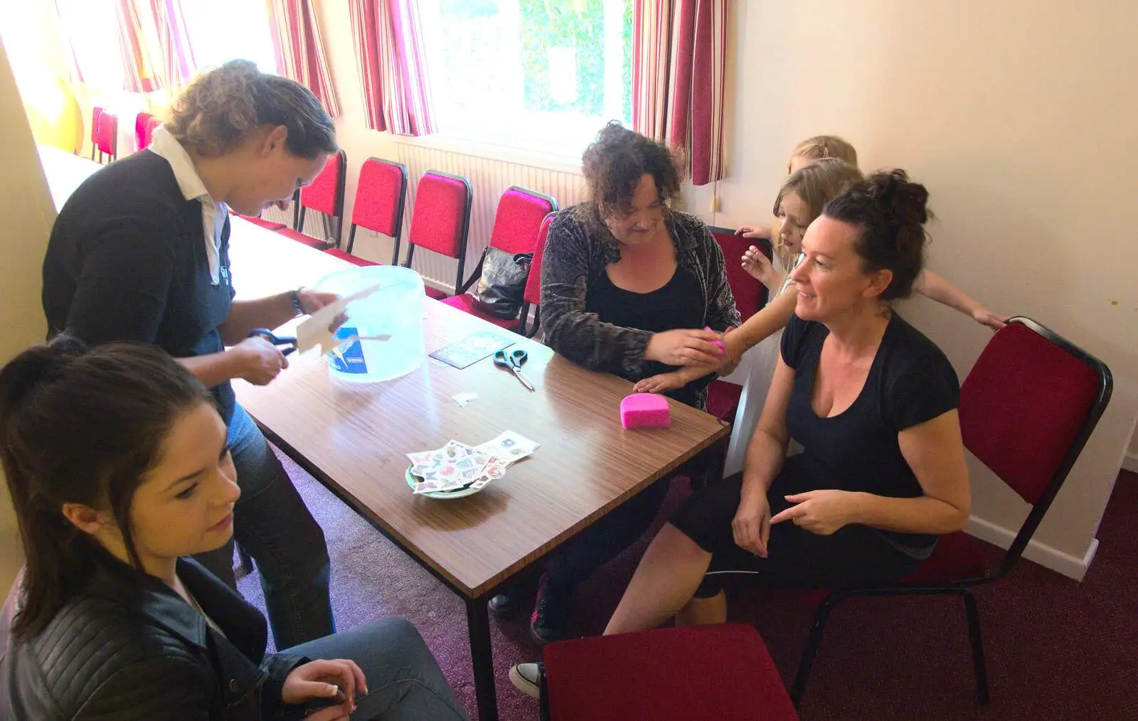 Louise does stick-on tattoos, from Fred's Fifth Birthday, The Village Hall, Brome, Suffolk - 28th September 2013