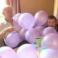 Grandad and Matthew under a pile of balloons, Fred's Fifth Birthday, The Village Hall, Brome, Suffolk - 28th September 2013