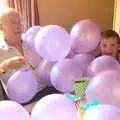 Grandad and Matthew under a pile of balloons, Fred's Fifth Birthday, The Village Hall, Brome, Suffolk - 28th September 2013