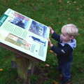 Harry checks an information sign, A November Miscellany and Building Progress, Thornham and Brome, Suffolk - 17th November 2013