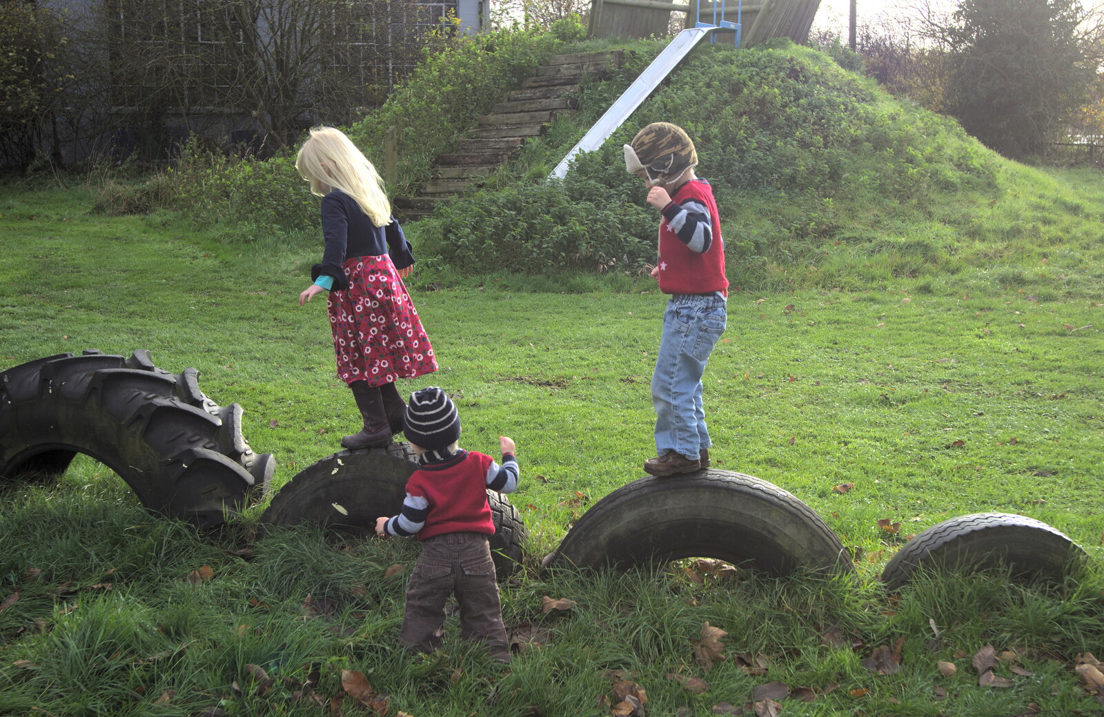 More Building and Palgrave Playground, Suffolk - 24th November 2013: Milly, Harry and Fred mess around on the tyres