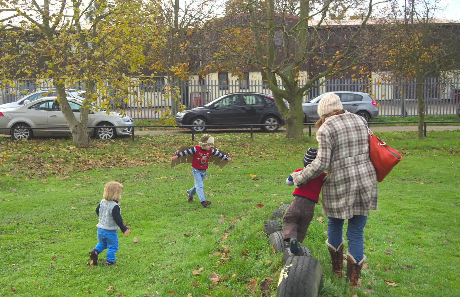 Fred runs around with his carboard wings, from More Building and Palgrave Playground, Suffolk - 24th November 2013