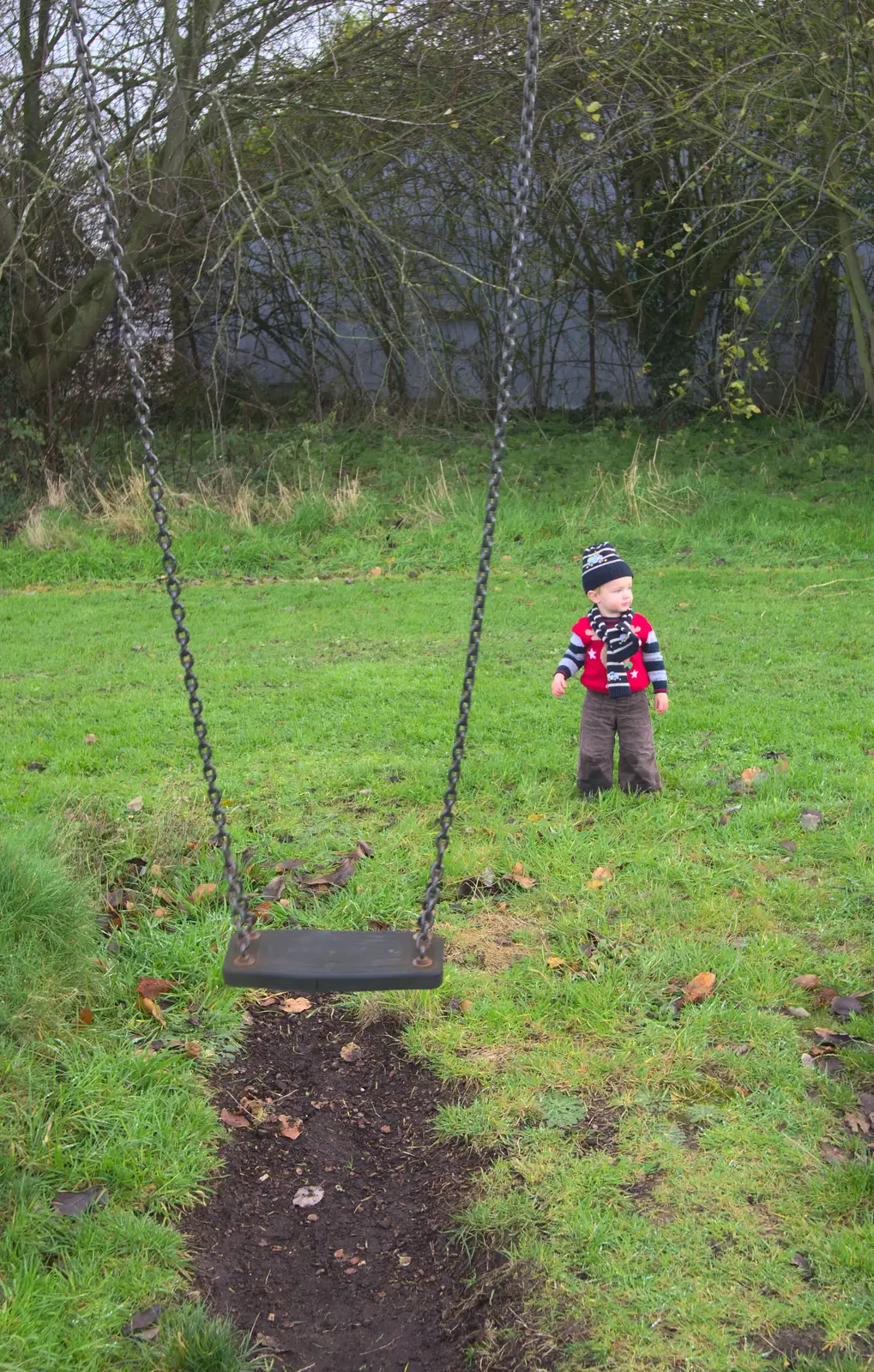 Harry stands next to the swing, from More Building and Palgrave Playground, Suffolk - 24th November 2013