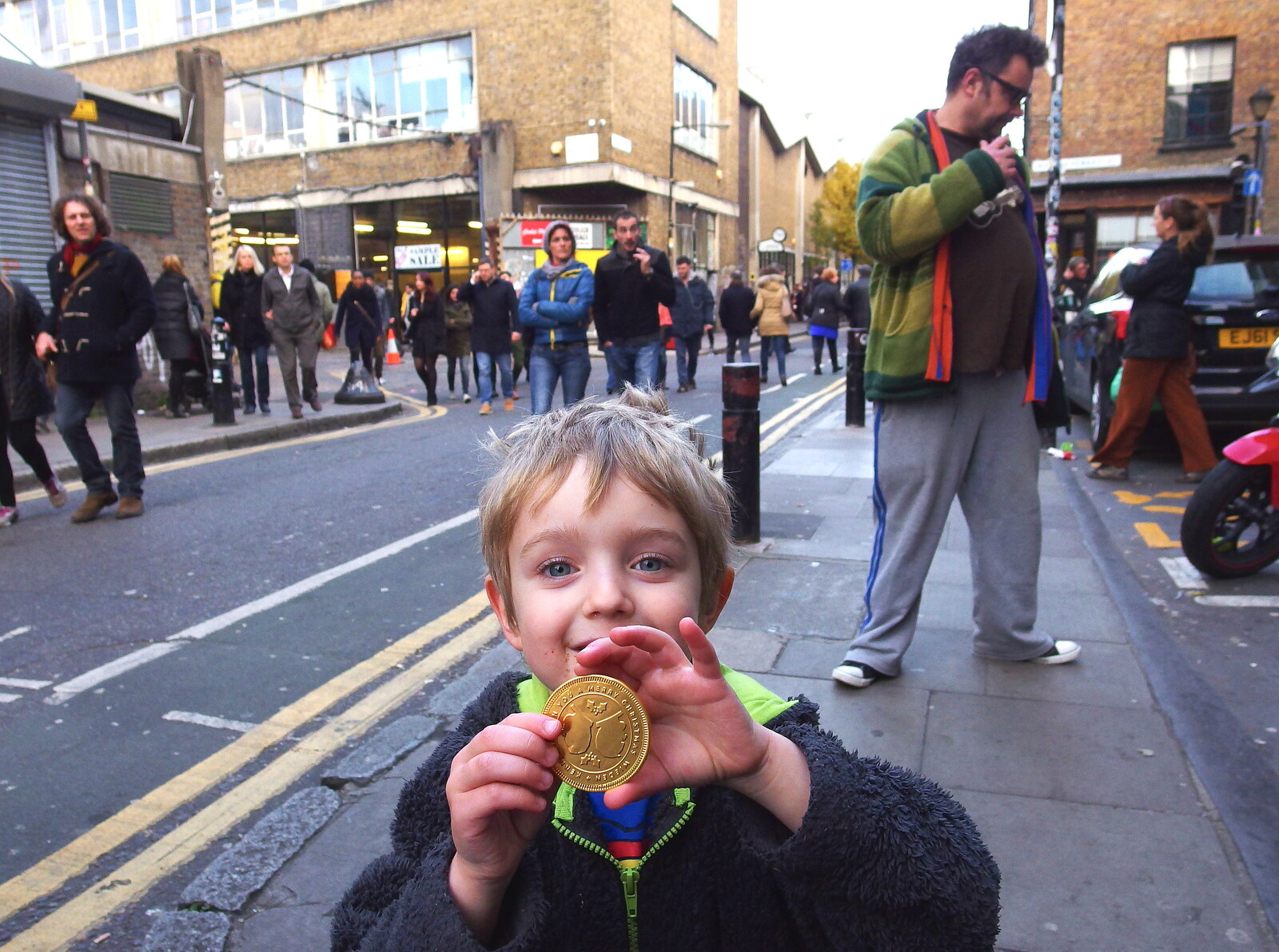 Fred shows off his shiny gold chocolate coin from Lunch in the East End, Spitalfields and Brick Lane, London - 1st December 2013