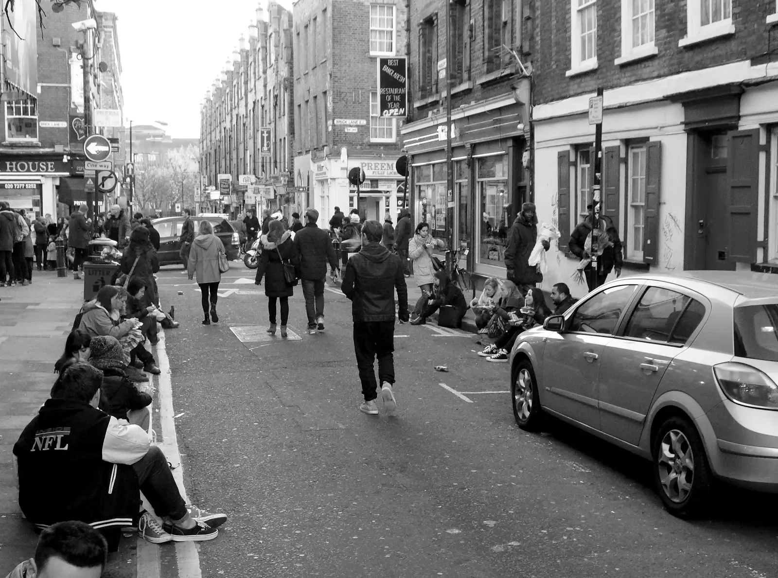 People hang around off Brick Lane just eating food, from Lunch in the East End, Spitalfields and Brick Lane, London - 1st December 2013