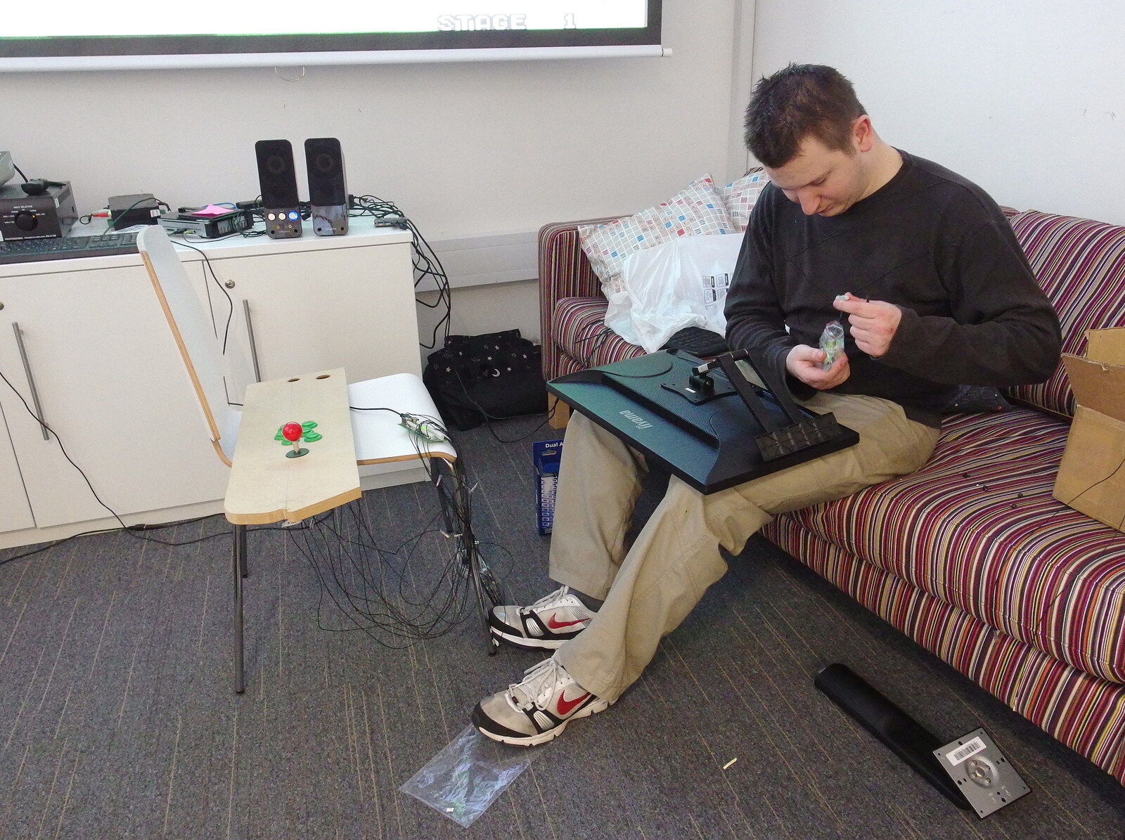 SwiftKey's Arcade Cabinet, and the Streets of Southwark, London - 5th December 2013: Joe works on a monitor