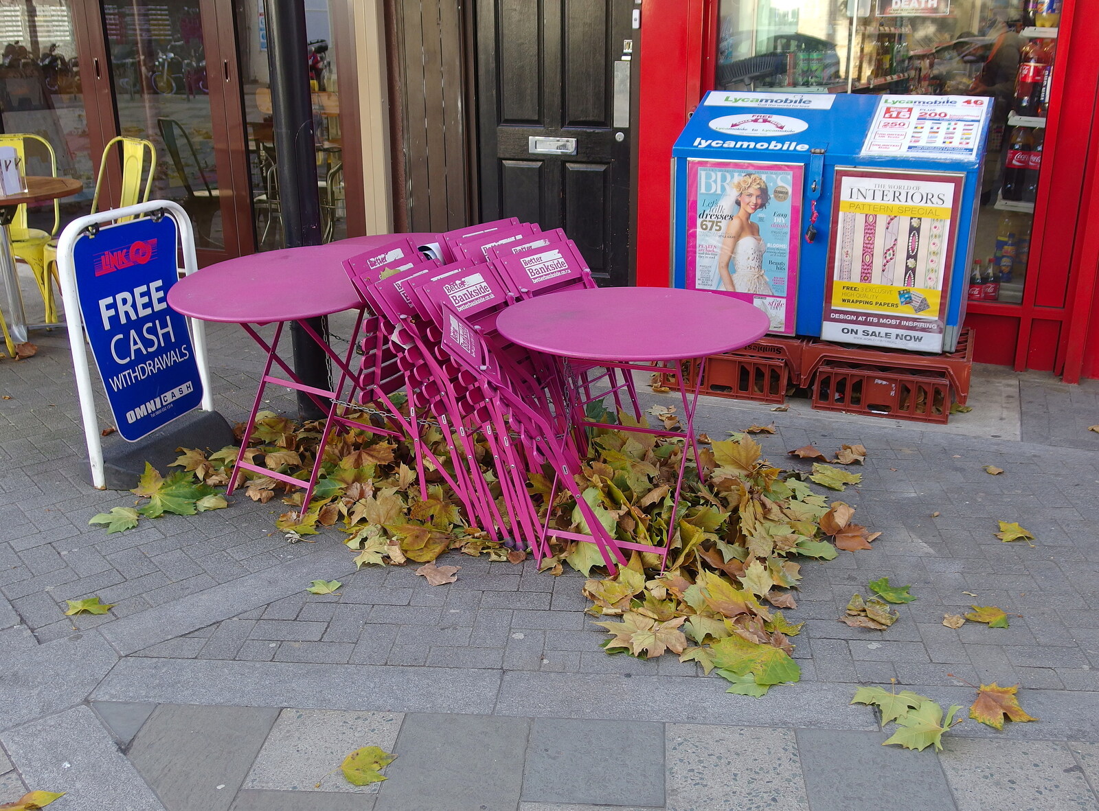 SwiftKey's Arcade Cabinet, and the Streets of Southwark, London - 5th December 2013: A pile of leaves around pink café furniture