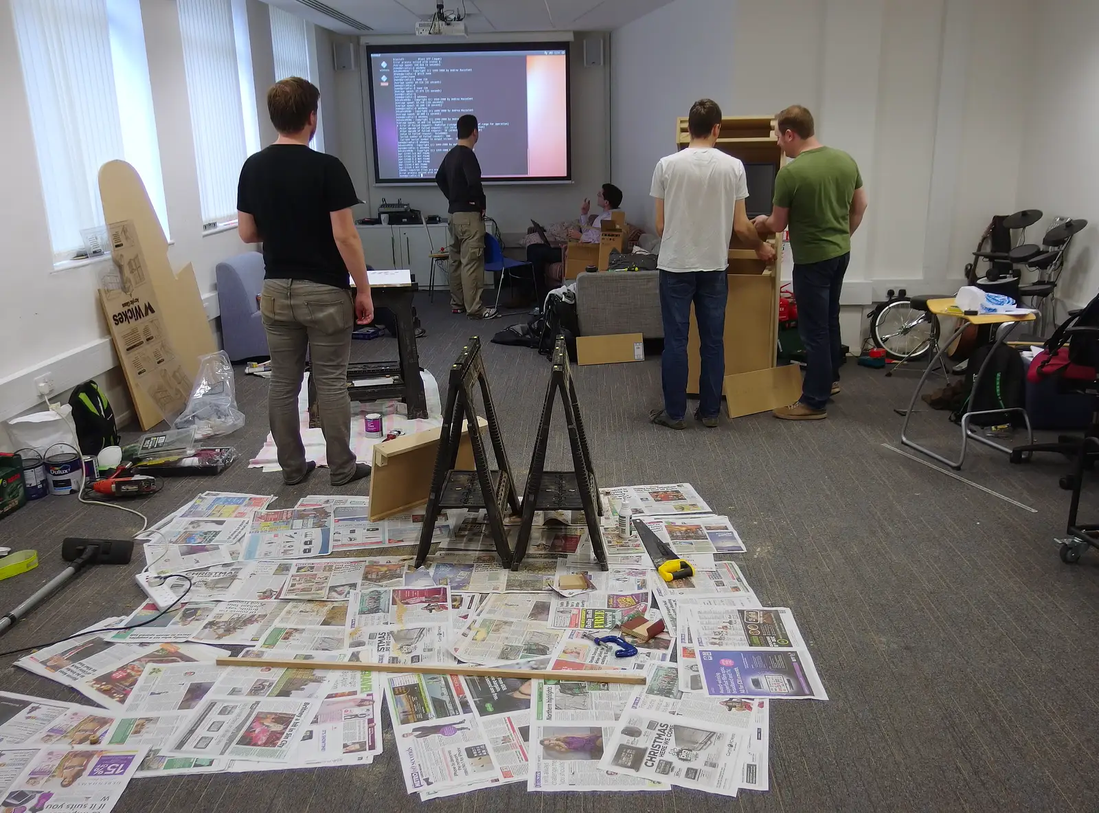 Newspapers are laid out for painting, from SwiftKey's Arcade Cabinet, and the Streets of Southwark, London - 5th December 2013