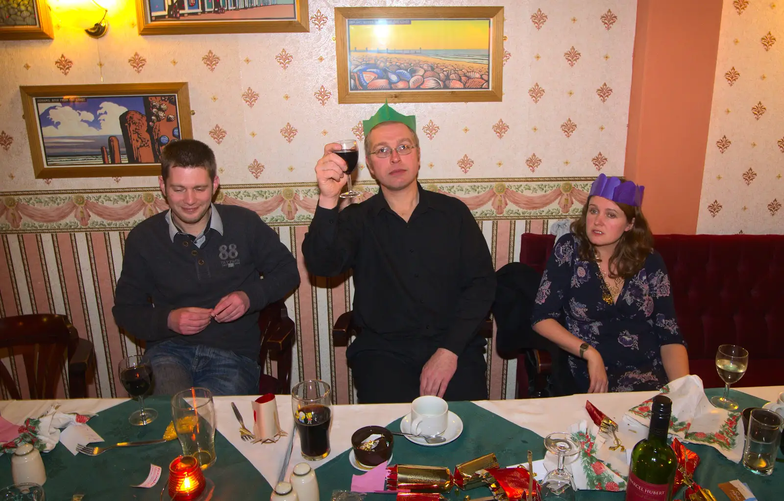 Marc holds up a glass, from The BSCC Christmas Dinner, Brome, Suffolk - 7th December 2013