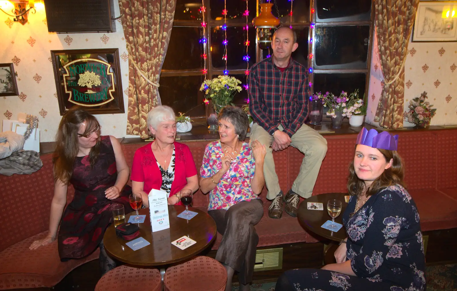 DH sits on the back of the seat, from The BSCC Christmas Dinner, Brome, Suffolk - 7th December 2013