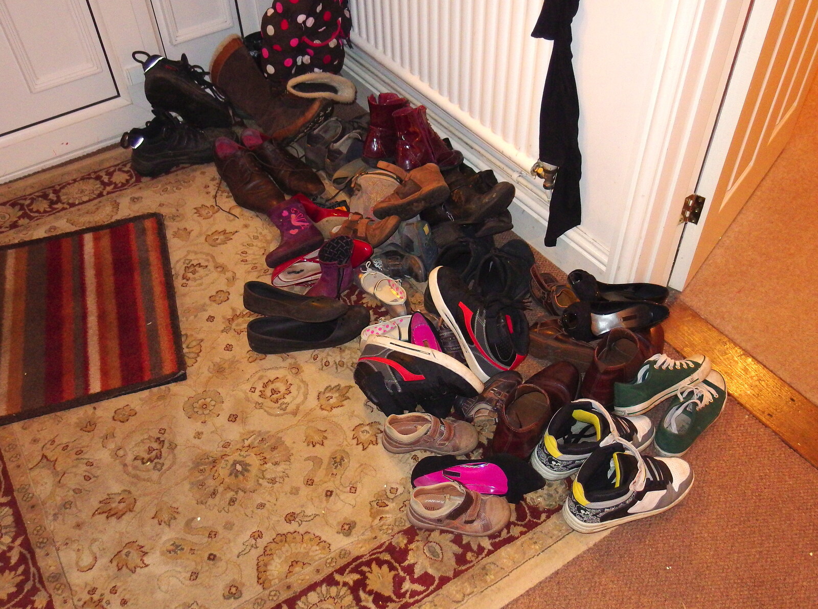 There's a small pile of shoes by the door from A Christmas Party, Brome, Suffolk - 21st December 2013