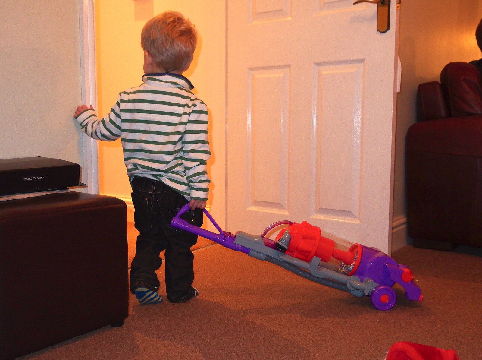 Jack looks up the corridor, with his hoover from A Christmas Party, Brome, Suffolk - 21st December 2013