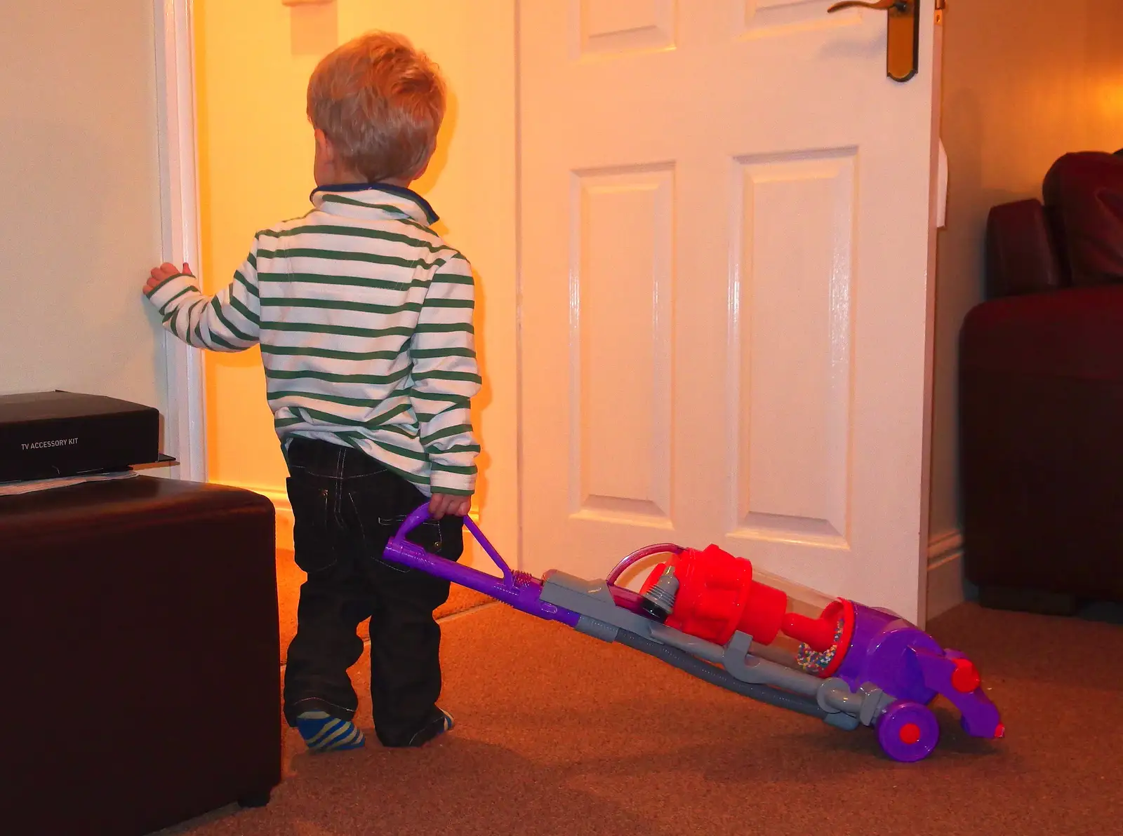 Jack looks up the corridor, with his hoover, from A Christmas Party, Brome, Suffolk - 21st December 2013