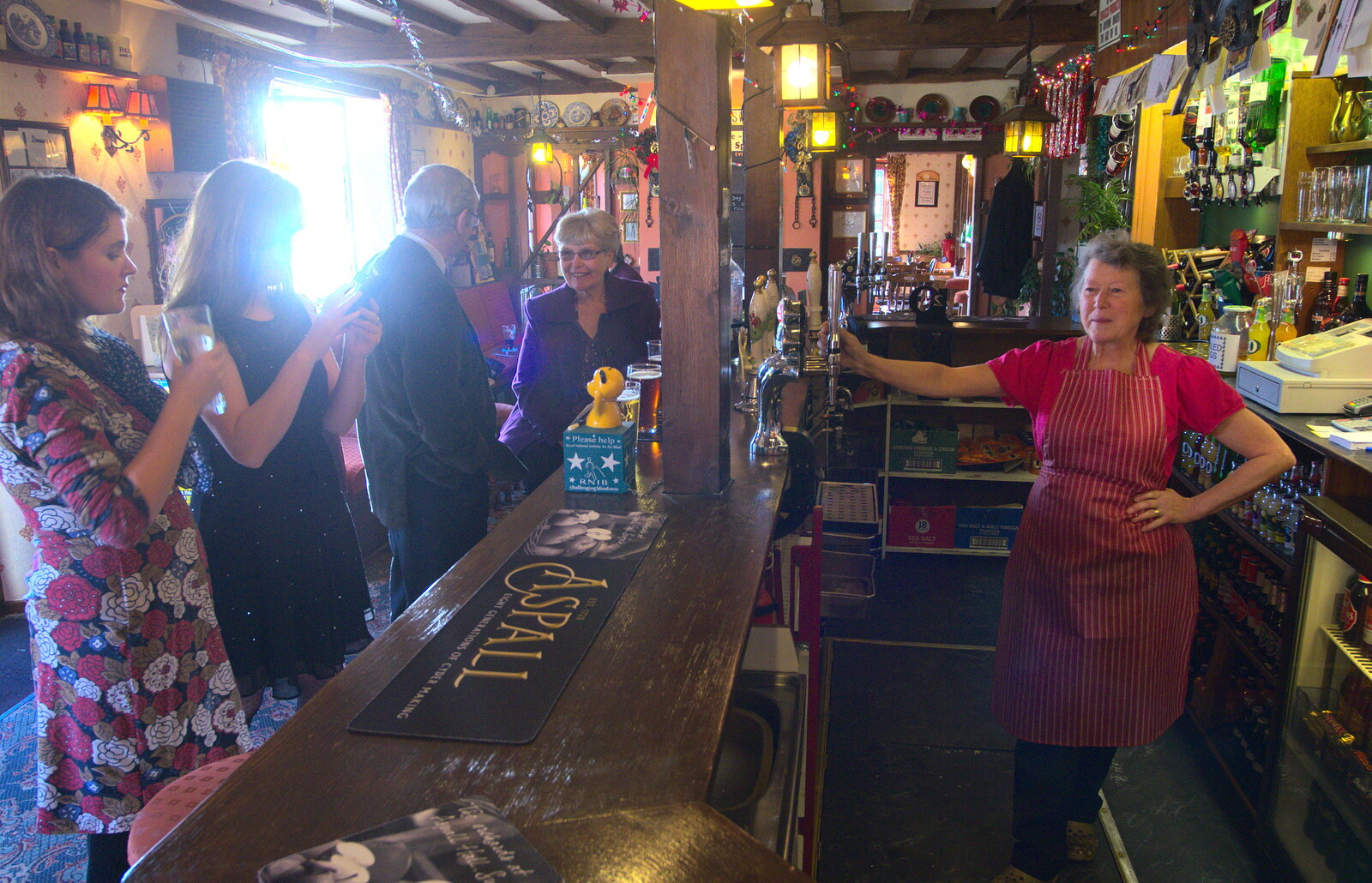 Sylvia behind the bar at The Swan from Christmas Day and all that, Brome, Suffolk - 25th December 2013