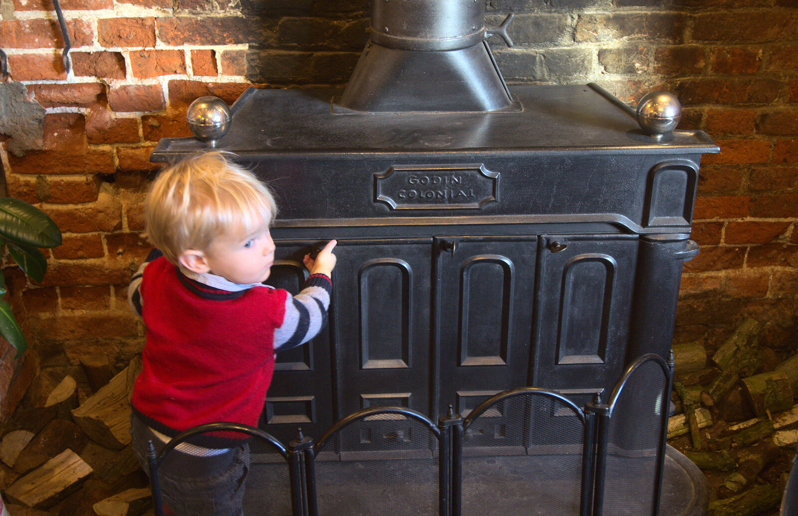 Harry pokes the wood burner from Christmas Day and all that, Brome, Suffolk - 25th December 2013