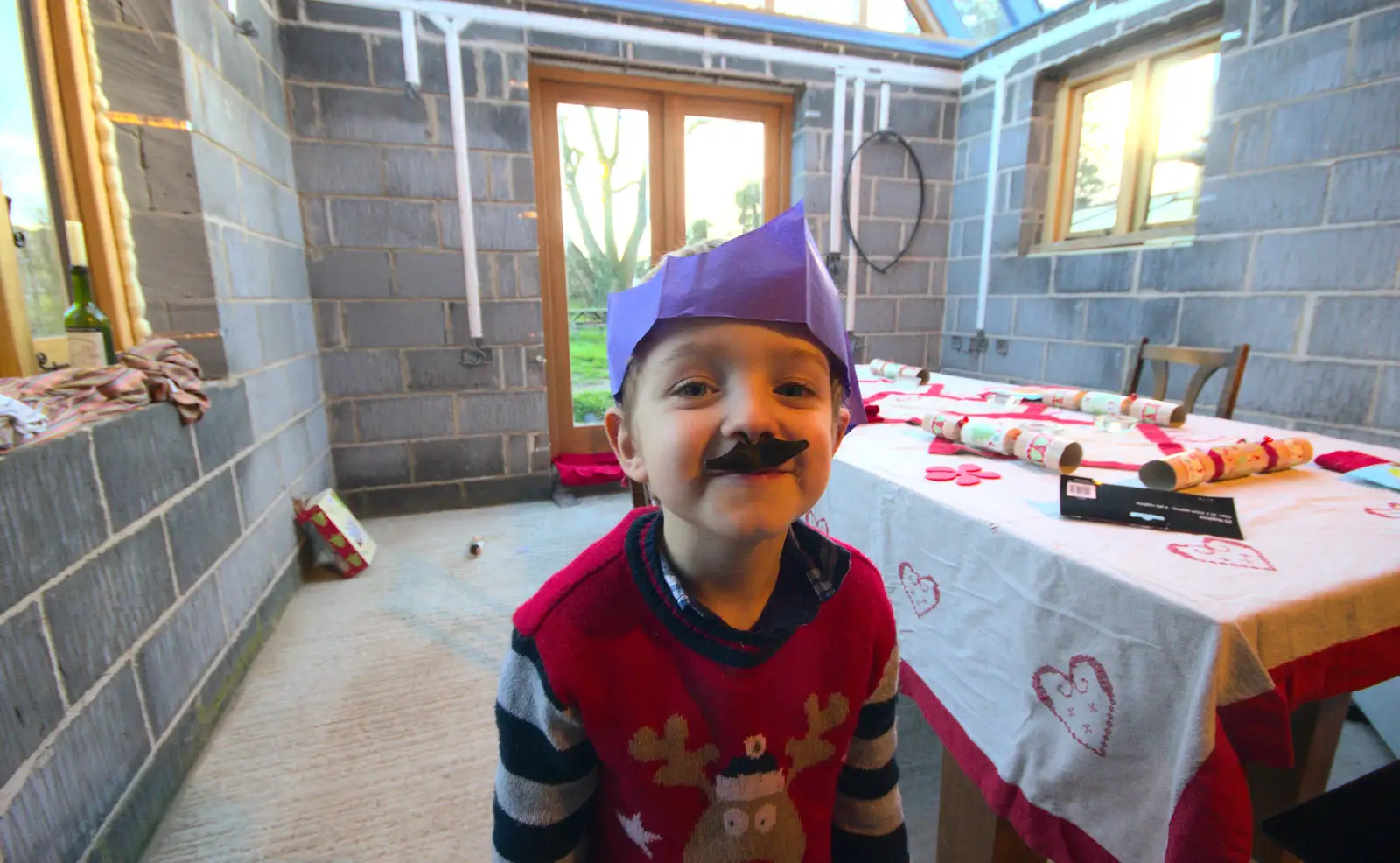 Fred sticks on a cracker moustache, from Christmas Day and all that, Brome, Suffolk - 25th December 2013