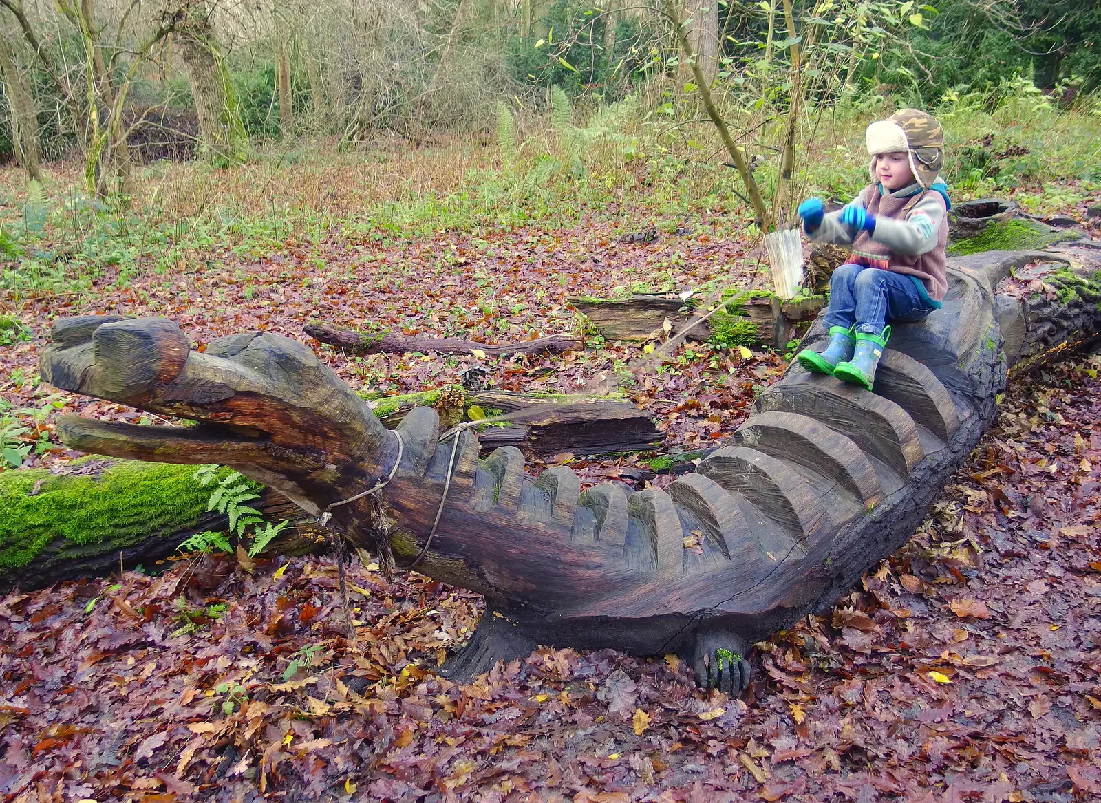 Fred rides the wooden dragon, from A Boxing Day Walk, Thornham Estate, Suffolk - 26th December 2013