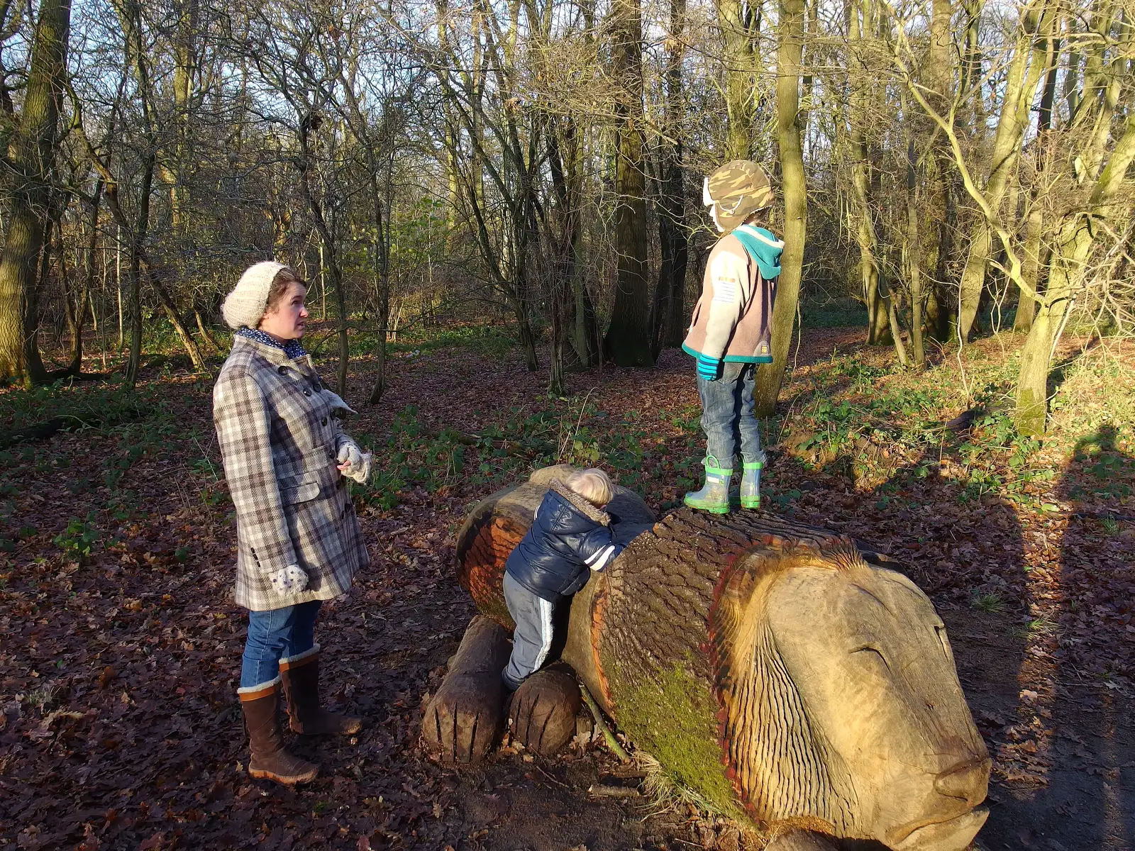 The boys on the carved lion log, from A Boxing Day Walk, Thornham Estate, Suffolk - 26th December 2013