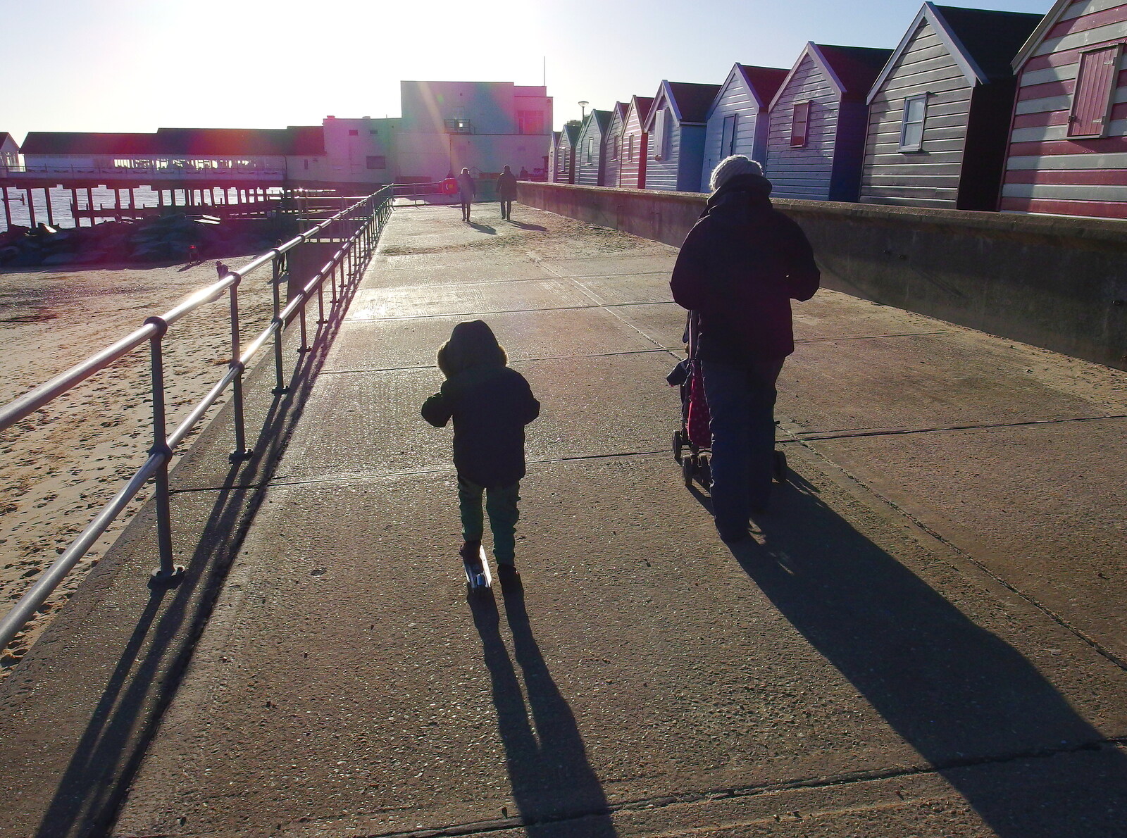 Fred and Isobel on the prom, contra jour from Post-Christmas Southwold, Suffolk - 29th December 2013