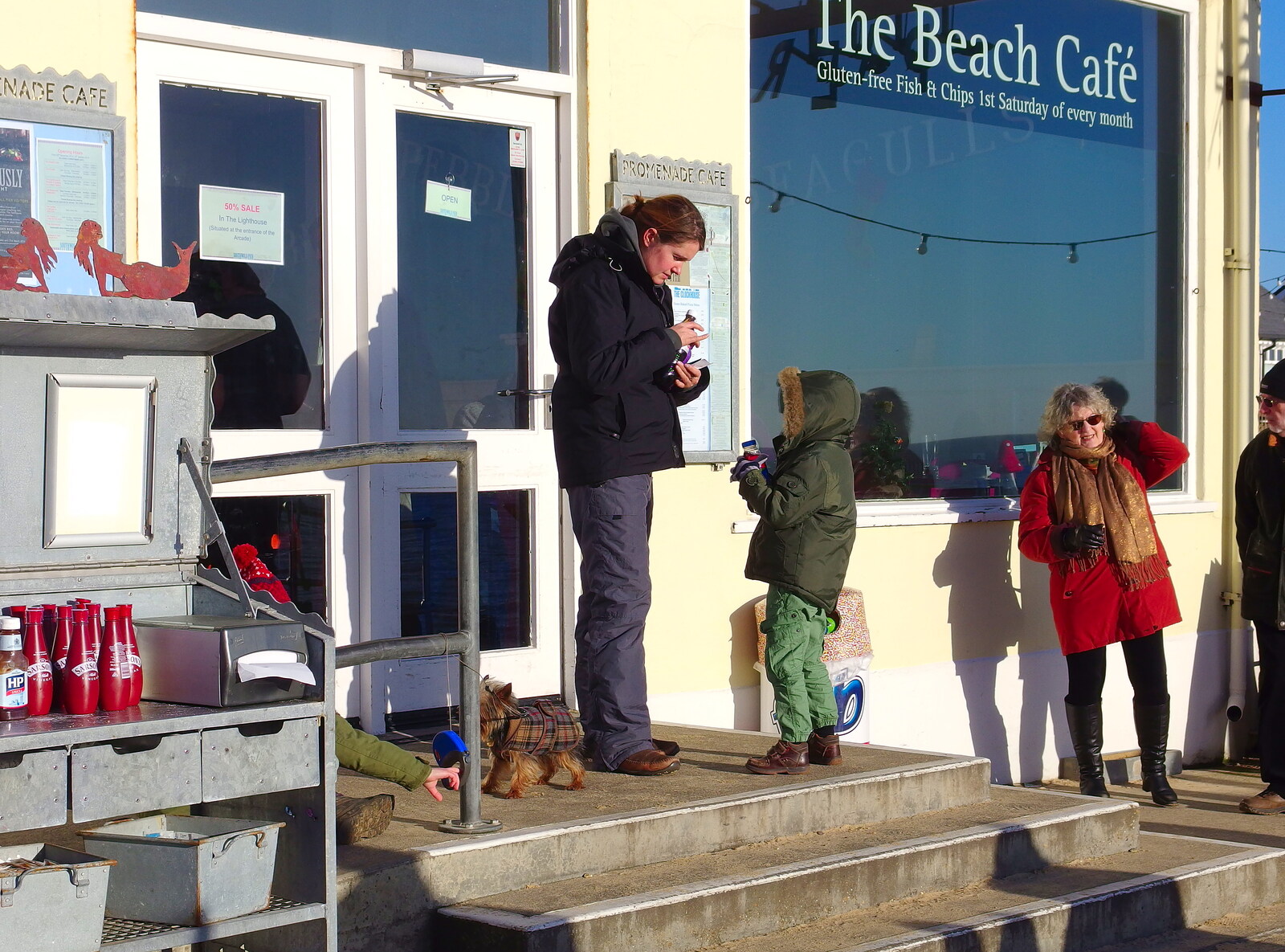 Isobel comes out of the Beach Café from Post-Christmas Southwold, Suffolk - 29th December 2013