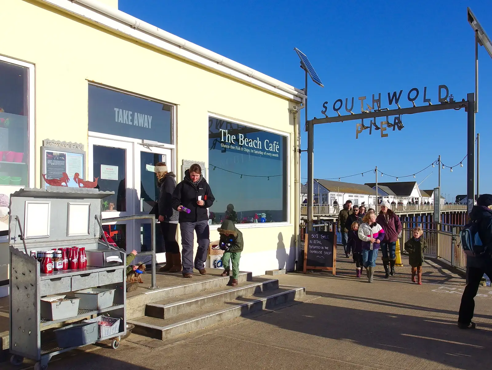 Isobel comes out of the Beach Café, from Post-Christmas Southwold, Suffolk - 29th December 2013