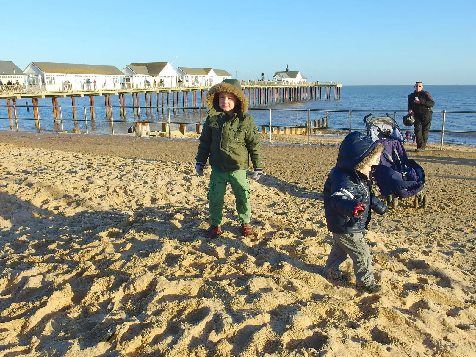 Fred and Harry roam around on the sand pile, from Post-Christmas Southwold, Suffolk - 29th December 2013