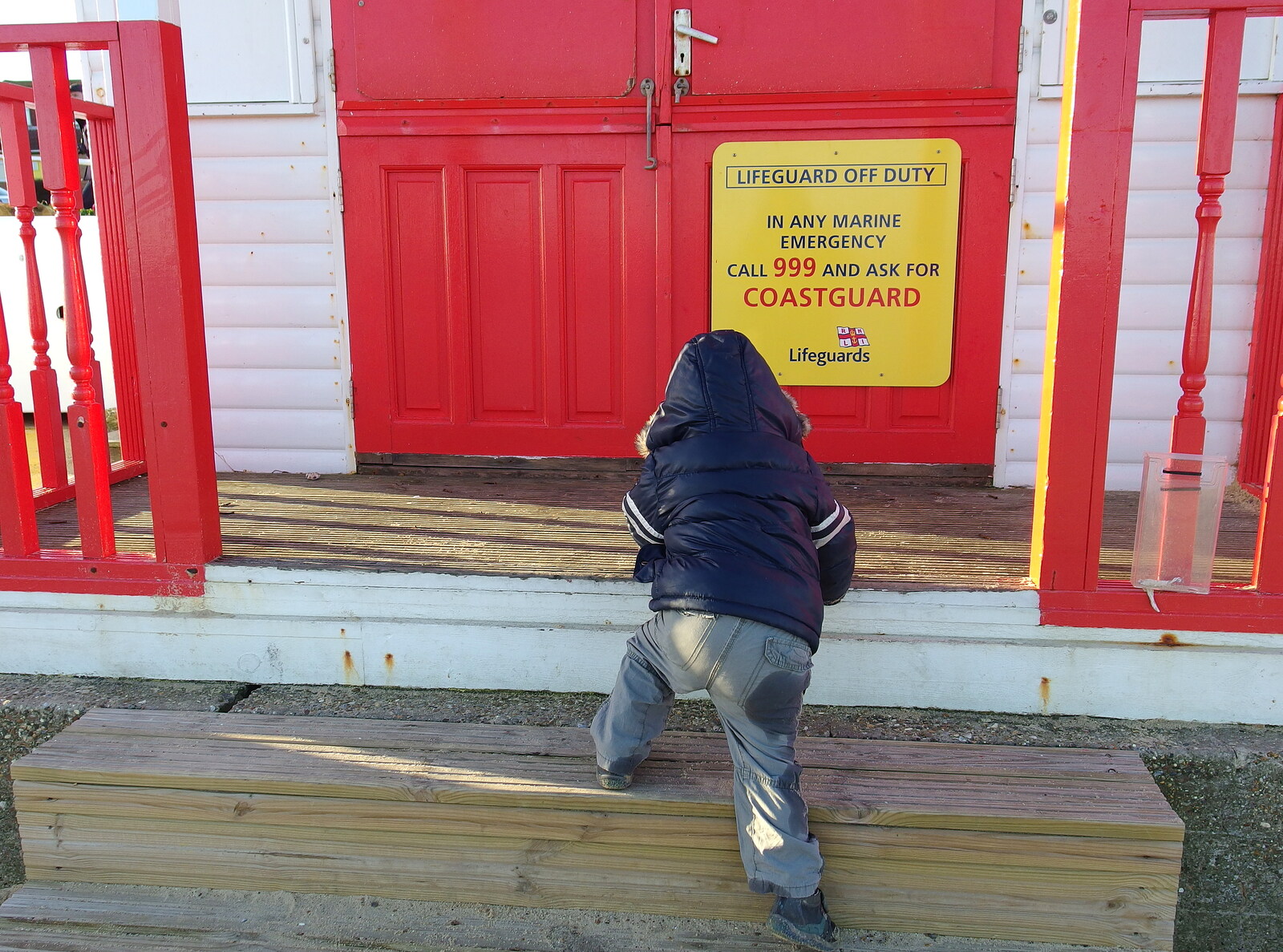 Harry climbs up to the coastguard hut from Post-Christmas Southwold, Suffolk - 29th December 2013