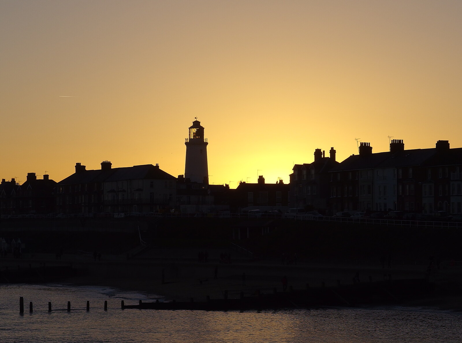 The sun sets behind the lighthouse from Post-Christmas Southwold, Suffolk - 29th December 2013