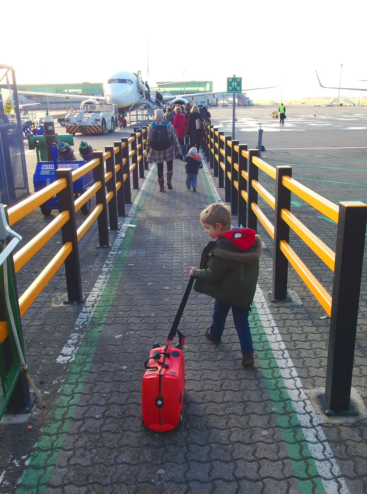 Fred trundles his Trunki up to the plane, from A Trip to Monkstown Farm and Blackrock, County Dublin, Ireland - 2nd January 2014