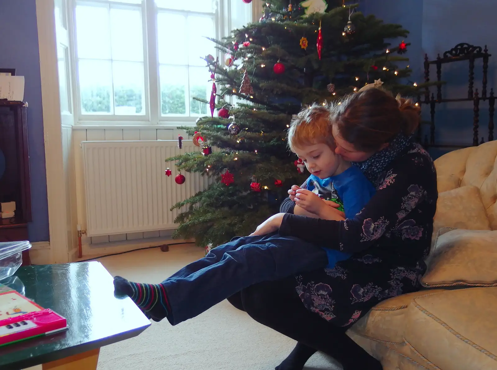 Fred and Isobel share a cuddle on the sofa, from A Trip to Monkstown Farm and Blackrock, County Dublin, Ireland - 2nd January 2014