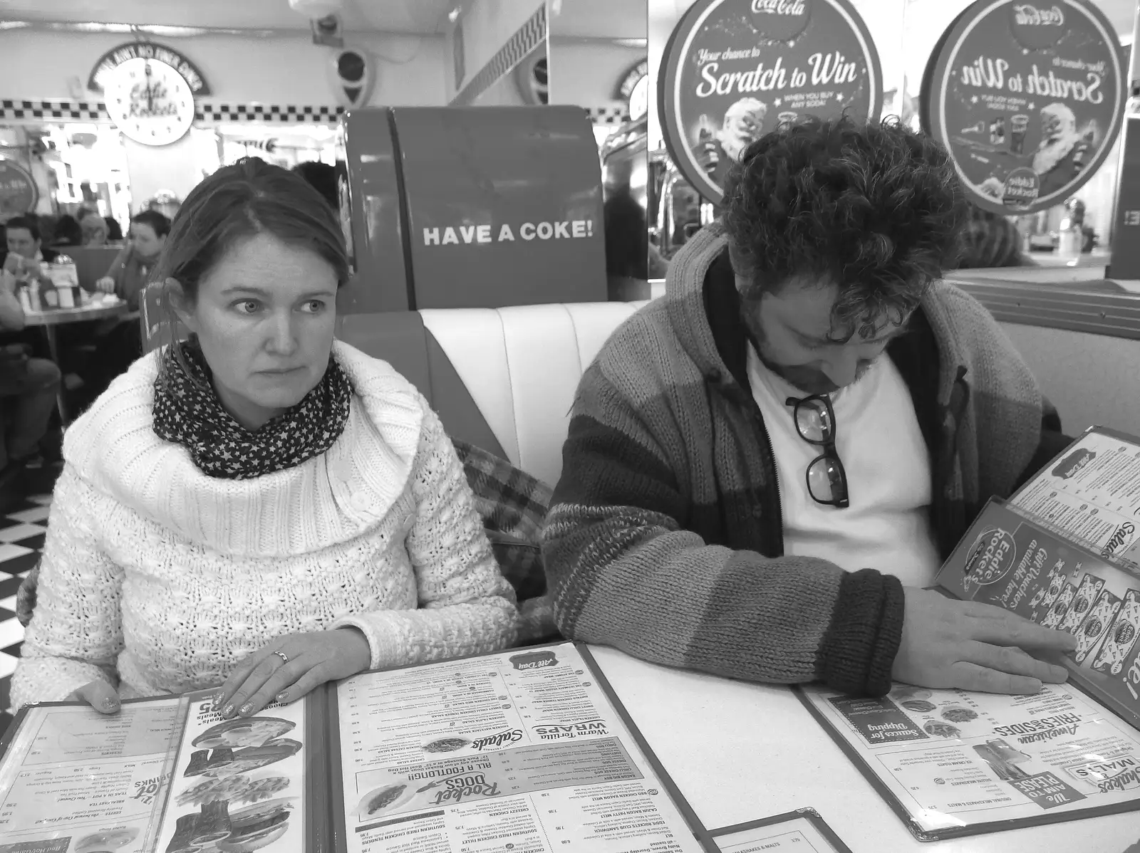 Isobel and Noddy inspect the menu in Eddy Rocket's, from A Trip to Monkstown Farm and Blackrock, County Dublin, Ireland - 2nd January 2014