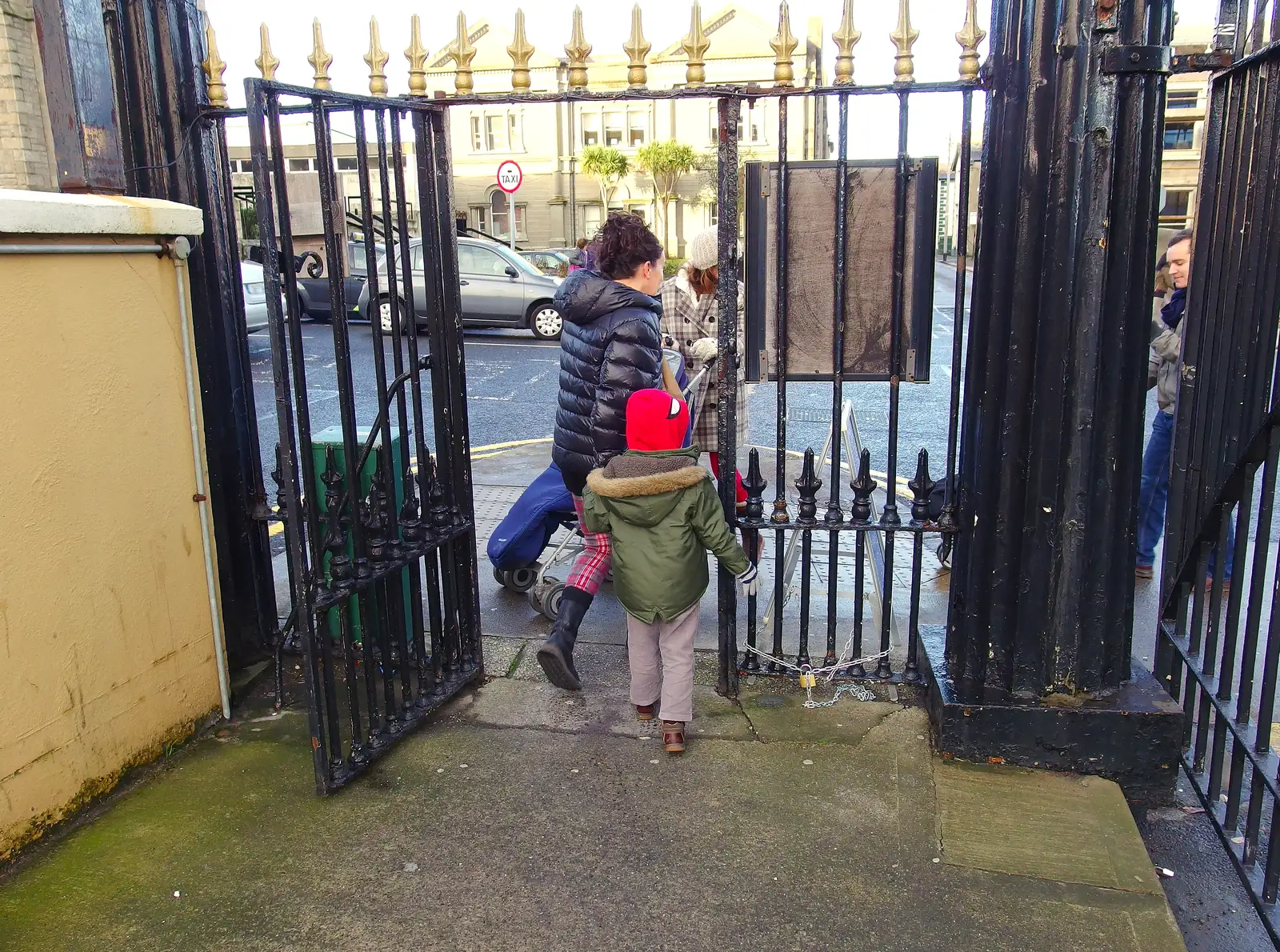 Evelyn and the gang head through an iron gate, from Dun Laoghaire and an Electrical Disaster, Monkstown, County Dublin, Ireland - 4th January 2014