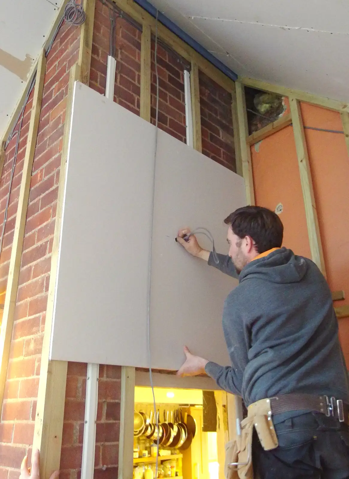 Bryan sticks some plasterboard up, from The BBs Photo Shoot, BOCM Pauls Pavilion, Burston, Norfolk - 12th January 2014