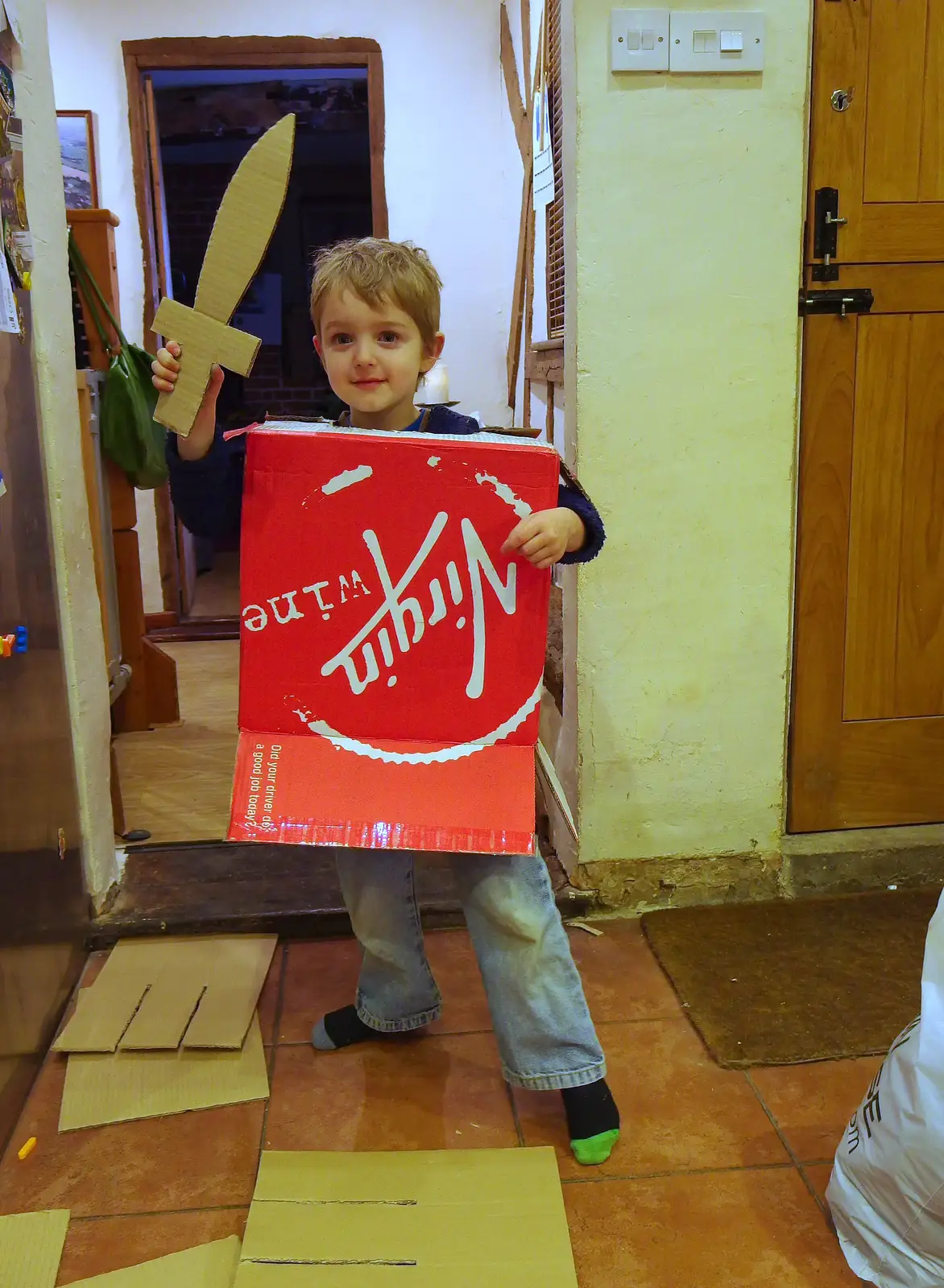 Fred's made a robot body and a sword out of cardboard, from A Ross Street Reunion, Hoxne, Suffolk - 25th January 2014