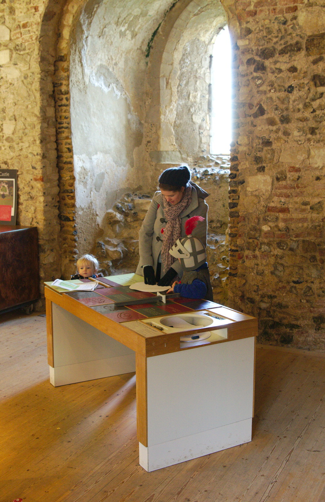Isobel and Fred do some rubbings from A Trip to Framlingham Castle, Framlingham, Suffolk - 16th February 2014