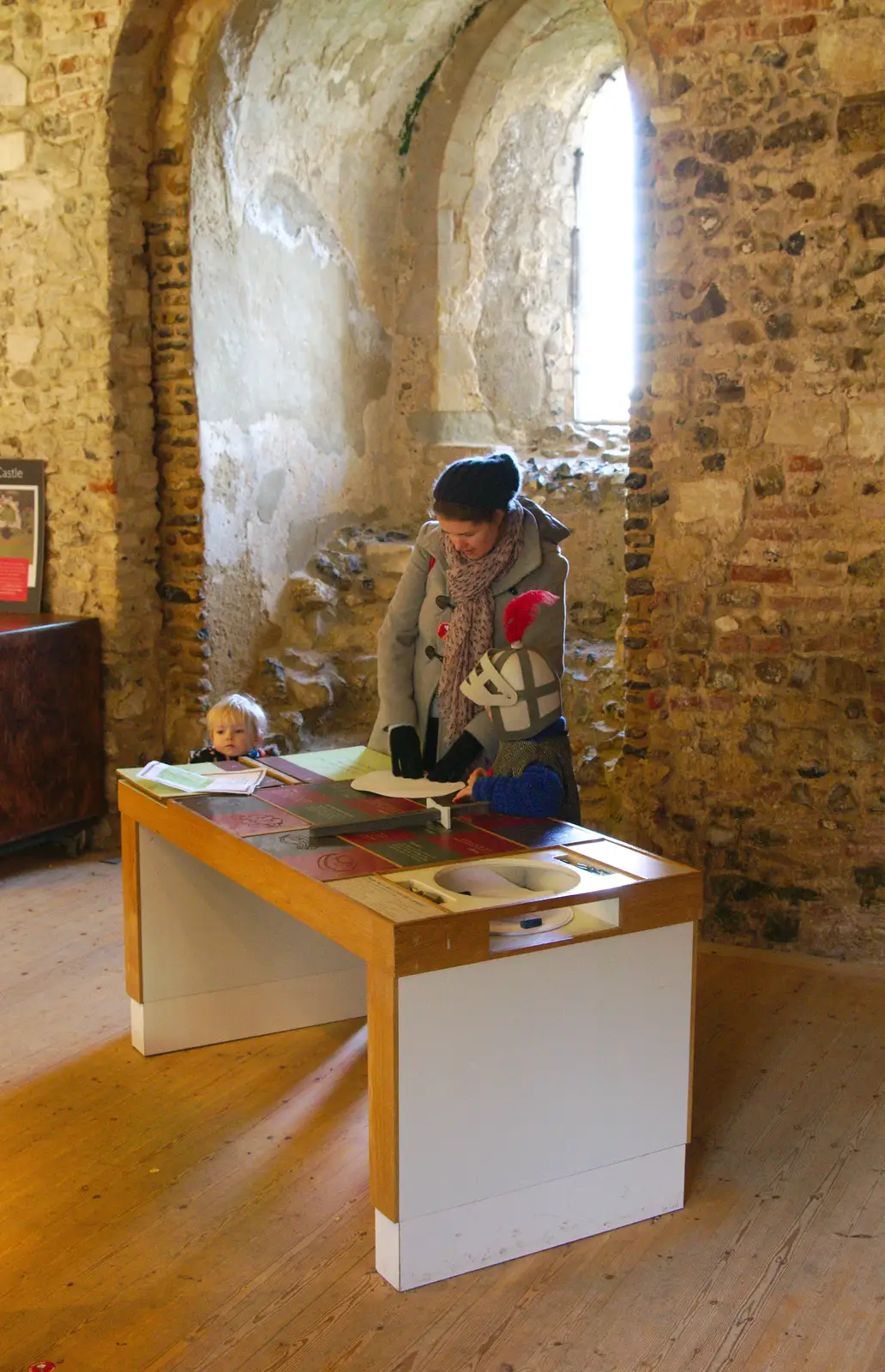 Isobel and Fred do some rubbings, from A Trip to Framlingham Castle, Framlingham, Suffolk - 16th February 2014