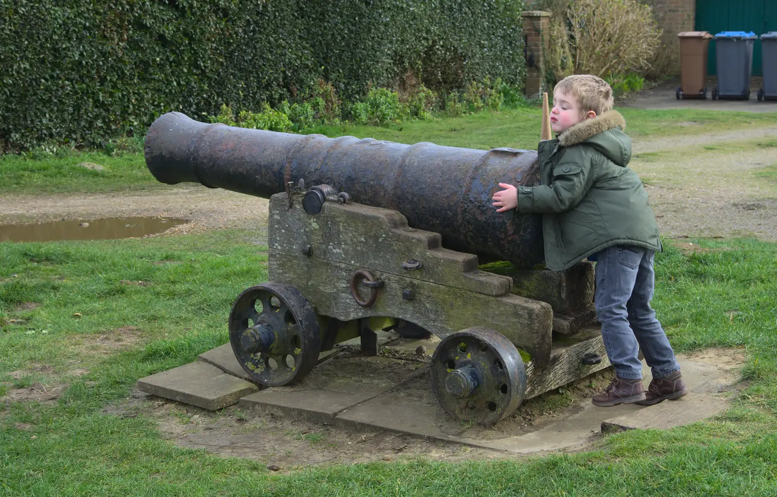 Fred hugs a cannon, from A Trip to Orford Castle, Orford, Suffolk - 2nd March 2014