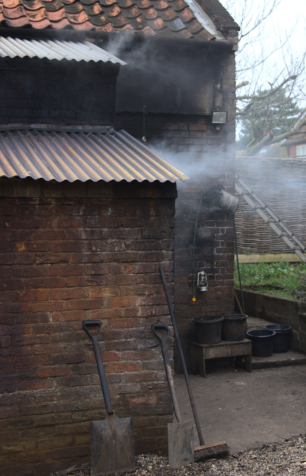Smoke drifts out of the smokehouse from A Trip to Orford Castle, Orford, Suffolk - 2nd March 2014