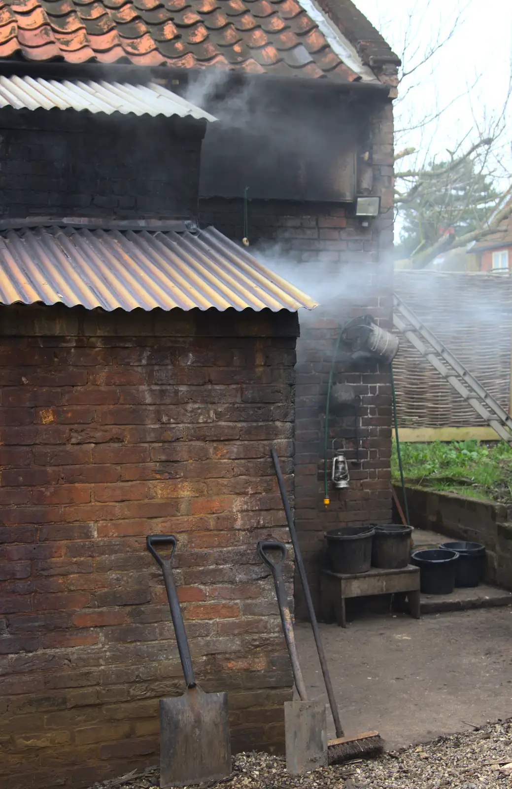 Smoke drifts out of the smokehouse, from A Trip to Orford Castle, Orford, Suffolk - 2nd March 2014