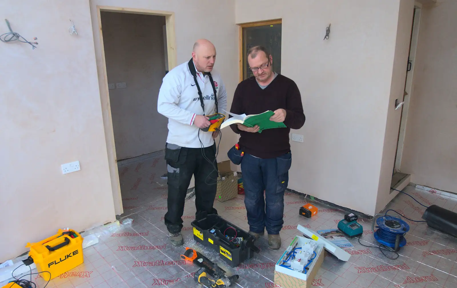 Boomer checks on the wiring regulations, from Building Progress: Electrical Second Fixing, Brome, Suffolk - 4th March 2014