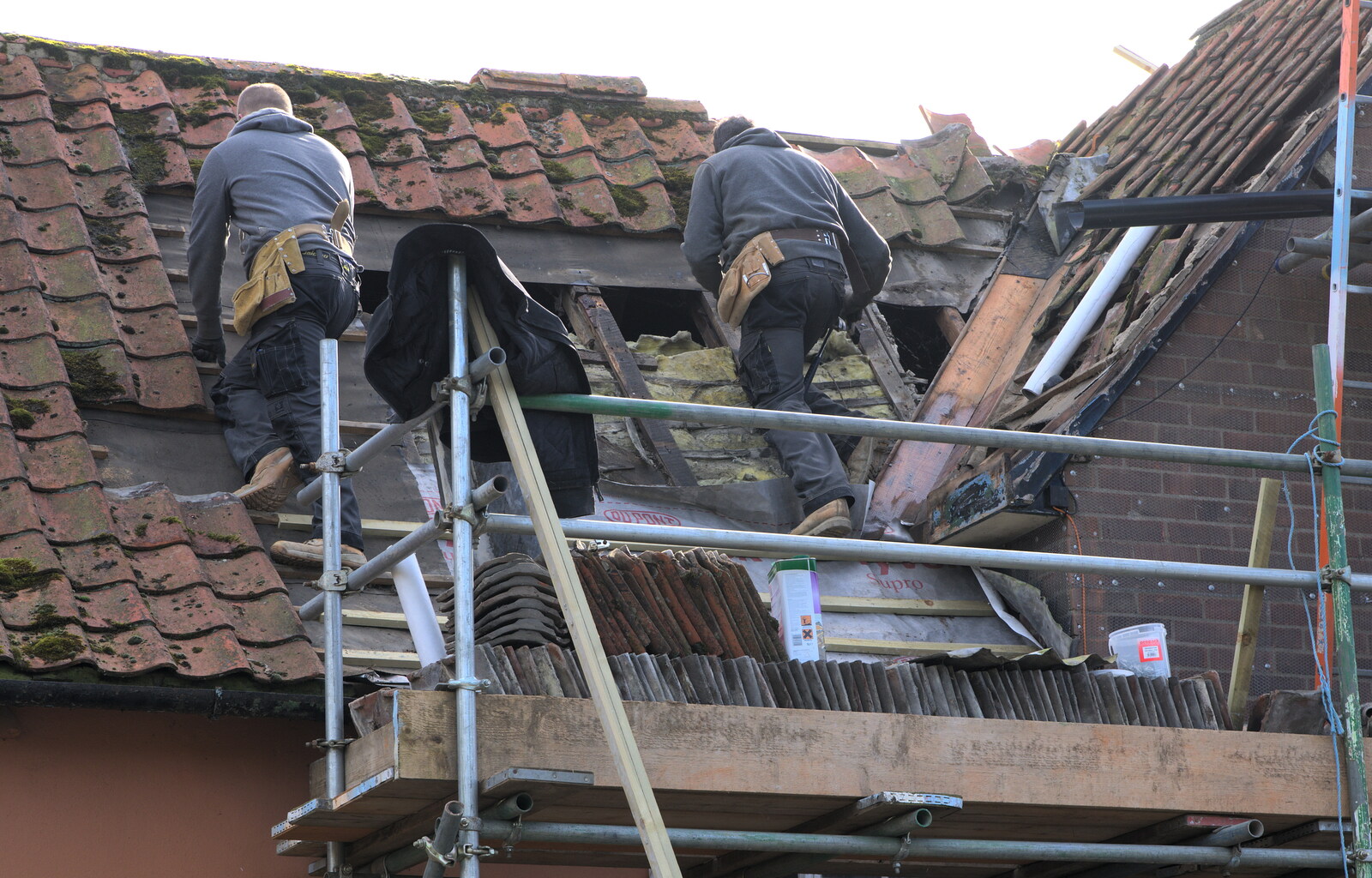 Lewis and Brian work on the old roof from Building Progress: Electrical Second Fixing, Brome, Suffolk - 4th March 2014