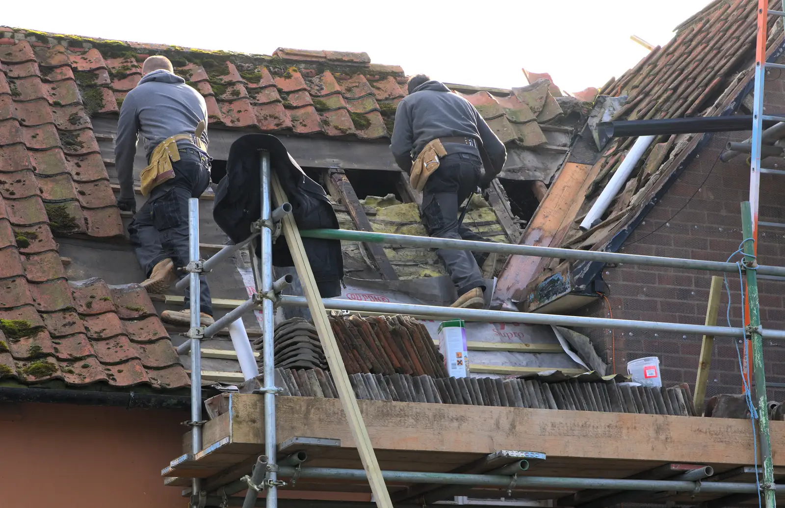 Lewis and Brian work on the old roof, from Building Progress: Electrical Second Fixing, Brome, Suffolk - 4th March 2014