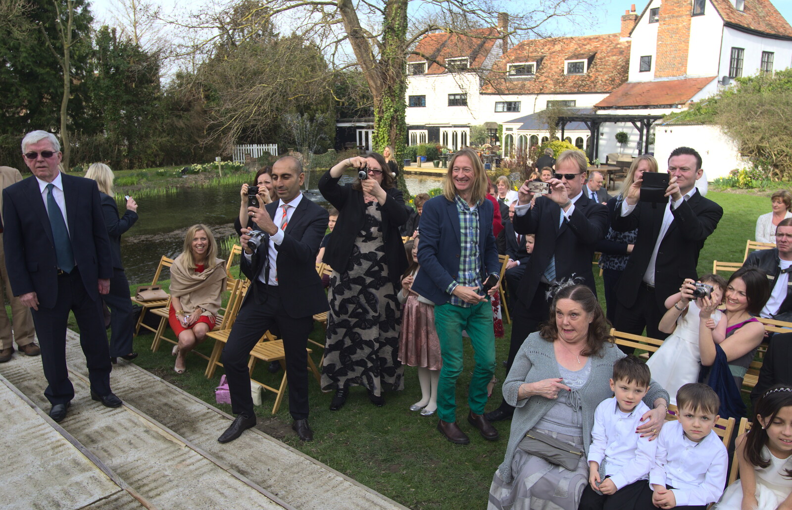 A paparazzi moment from John and Caroline's Wedding, Sheene Mill, Melbourne, Cambridgeshire - 8th March 2014