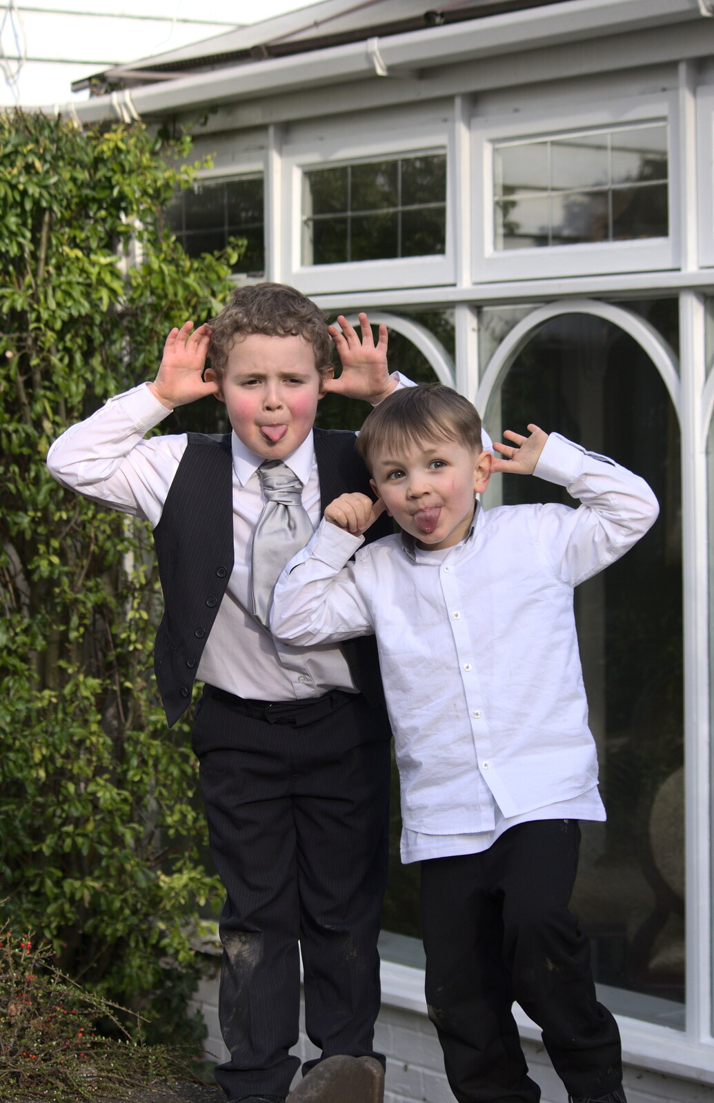 Lucas and a friend pull faces from John and Caroline's Wedding, Sheene Mill, Melbourne, Cambridgeshire - 8th March 2014