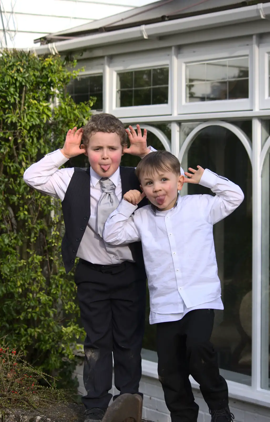 Lucas and a friend pull faces, from John and Caroline's Wedding, Sheene Mill, Melbourne, Cambridgeshire - 8th March 2014