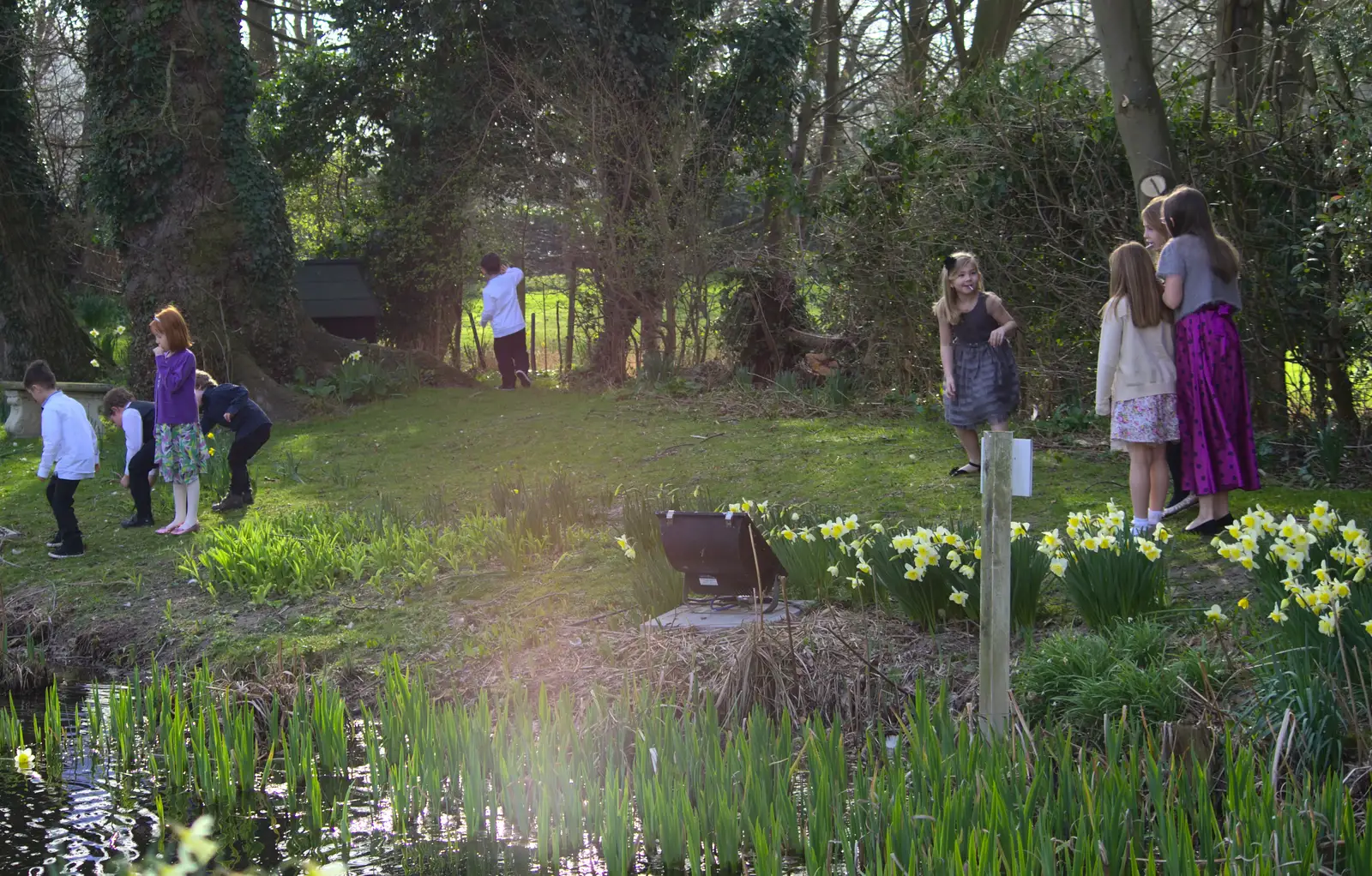 The gang of children run off around the pond, from John and Caroline's Wedding, Sheene Mill, Melbourne, Cambridgeshire - 8th March 2014