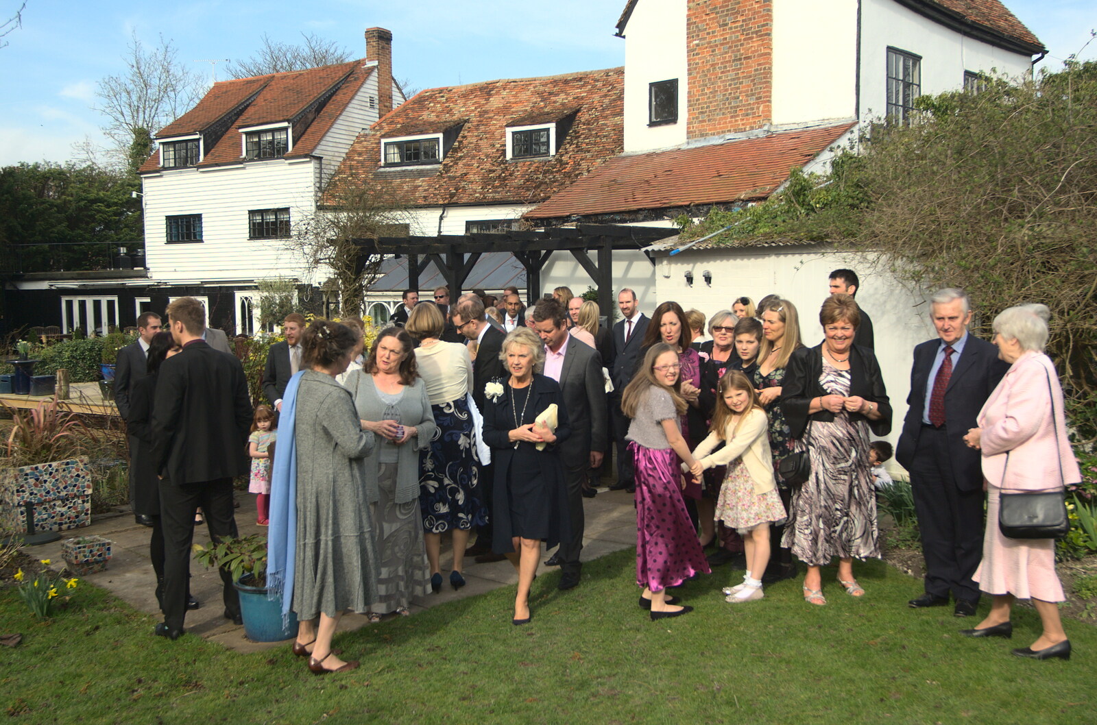 Guests outside the venue from John and Caroline's Wedding, Sheene Mill, Melbourne, Cambridgeshire - 8th March 2014