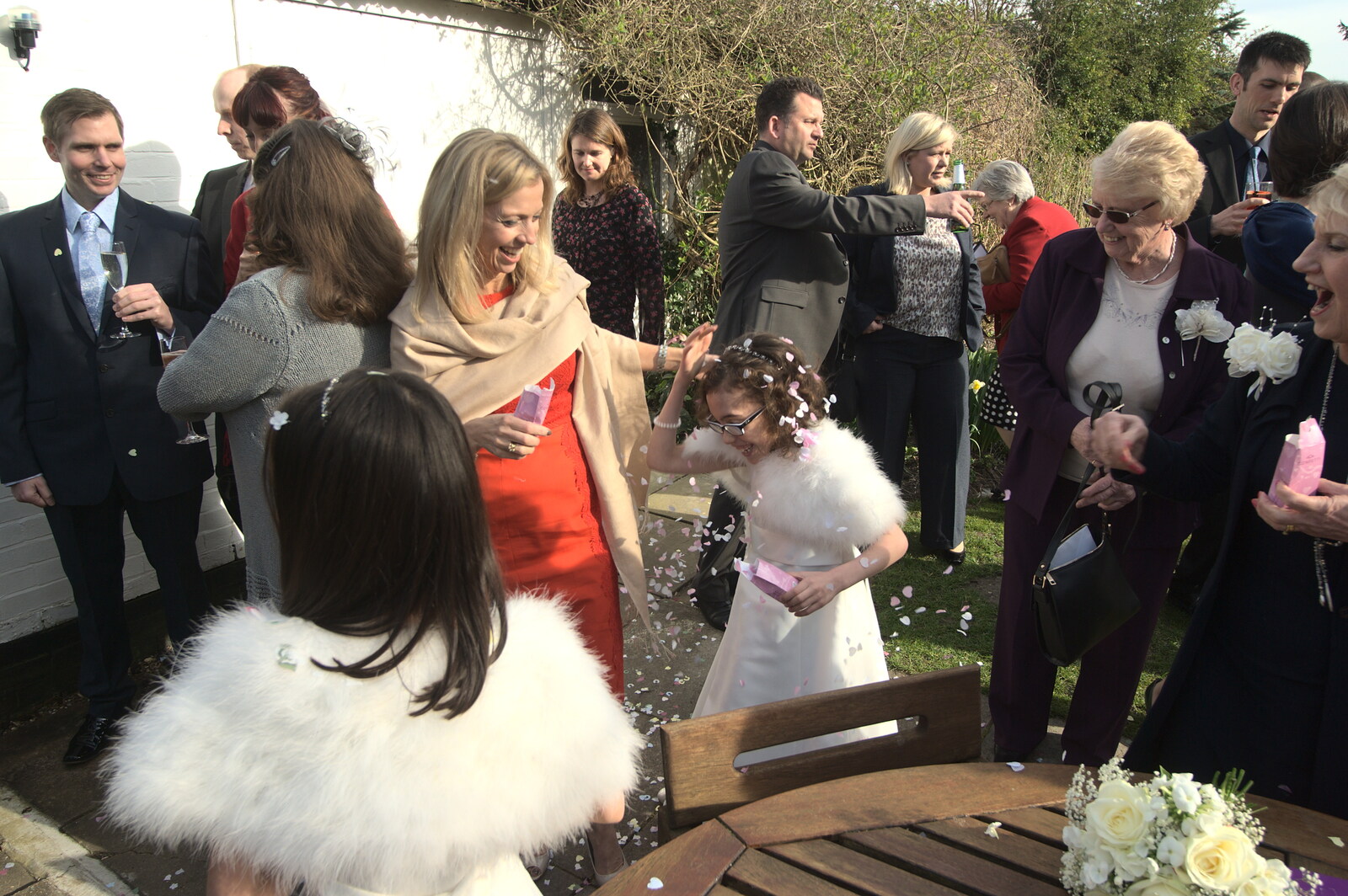 Confetti is hurled about from John and Caroline's Wedding, Sheene Mill, Melbourne, Cambridgeshire - 8th March 2014